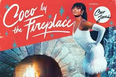 coco by the fireplace